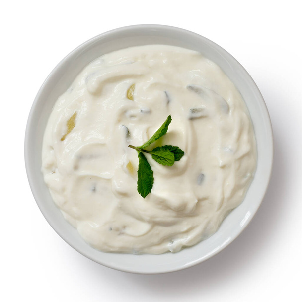 Tzatziki in white ceramic bowl isolated on white from above. Min - Photo, Image