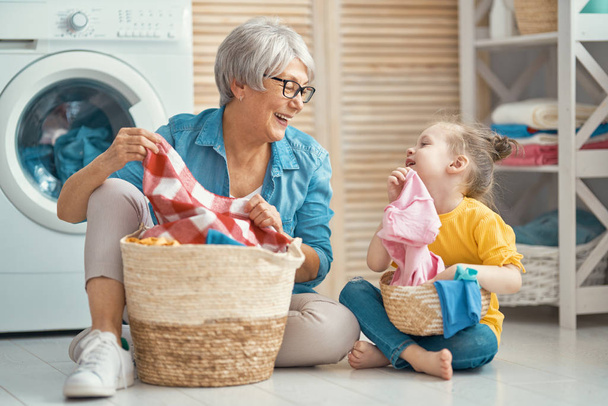 family doing laundry - Foto, Bild