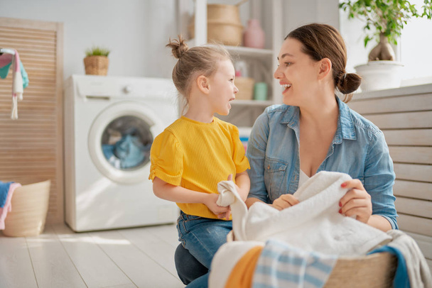 family doing laundry - Фото, изображение