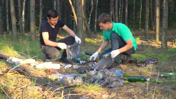 volunteers clean up garbage in forest - Footage, Video