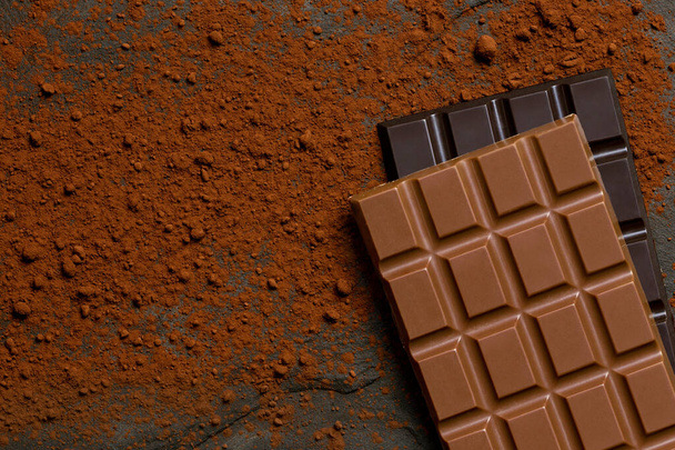 A slab of milk chocolate on top of a slab of dark chocolate on b - Foto, Imagem