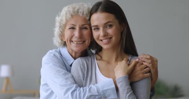 Affectionate two generation women grandmother and grandchild family portrait - Filmagem, Vídeo