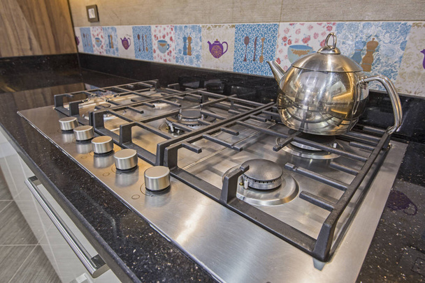 Modern kitchen cooker hob in a luxury apartment - Fotoğraf, Görsel