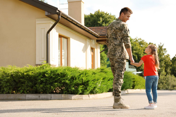 Father in military uniform with his little daughter outdoors - Foto, Bild