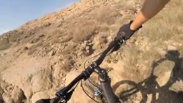 Man riding enduro mountain bike on rocky trail at the seaside in Croatia. View from first person perspective POV. Gimbal stabilized video. Shot with GOPRO HERO4 2.7K. - 映像、動画
