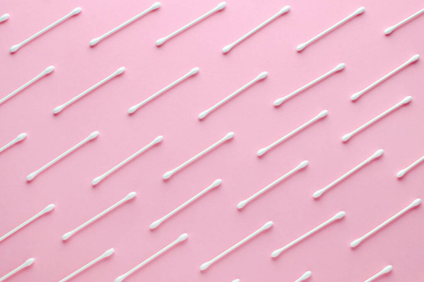 white cotton paper sticks on pink background, flat lay - Foto, Bild