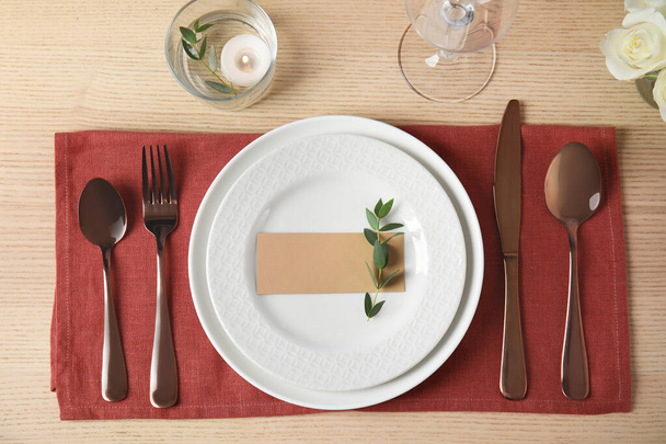 Elegant festive table setting with blank card in restaurant - Foto, immagini