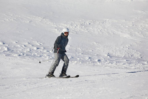 Skiing in the winter snowy slopes - Photo, image