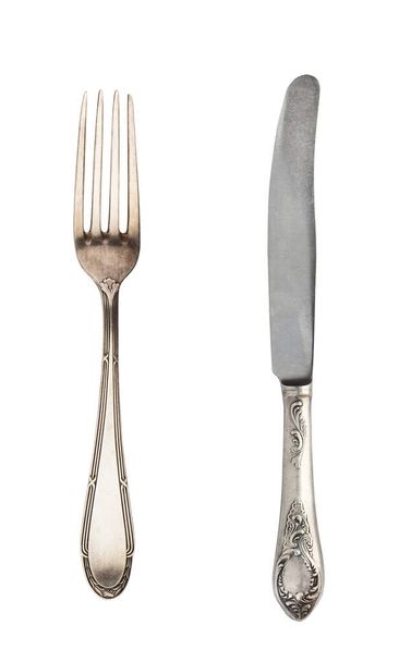 Mooie oude vintage vork en mes geïsoleerd op witte backgroun - Foto, afbeelding