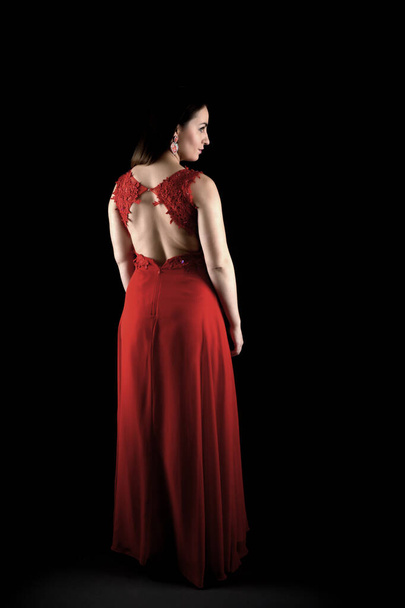 Beautiful fashion woman in red dress. - Фото, зображення