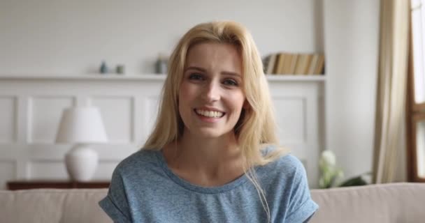 Young beautiful casual woman talking to camera communicating online - Filmmaterial, Video