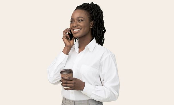 Afro Businesswoman Talking On Cellphone Drinking Coffee, Studio Shot - Фото, изображение