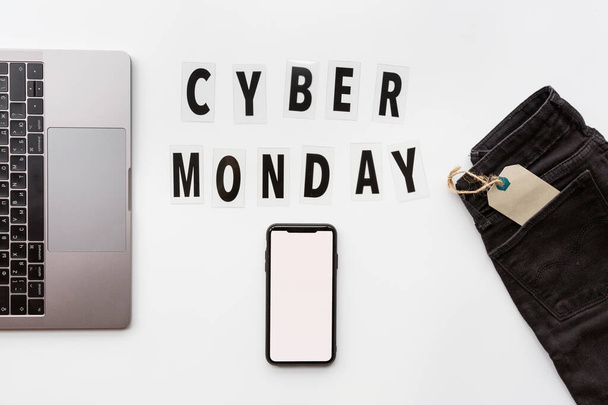 Creative promotion composition Cyber monday text and laptop on white background. Flat lay, top view, overhead, mockup, template. Minimal abstract background. Online shopping, sale, promo. Web banner - Foto, immagini