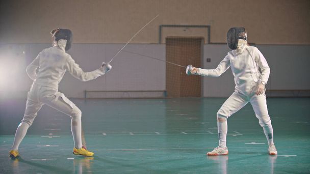 In the school gym wo fencers are training - Photo, Image