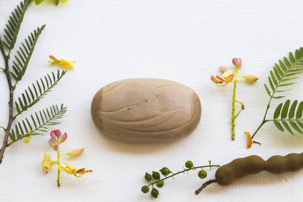 herbal soap extract vegetation tamarind health care for body skin of lifestyle clean a bath arrangement flat lay style on background white.  - Photo, Image