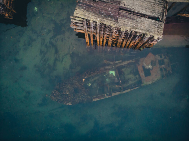 Cemetery of old ships in Teriberka Murmansk Russia, dramatic photo. Aerial top view - Photo, Image