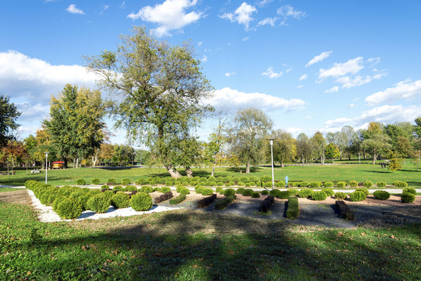 A footpath along landscaped garden area in Bundek city park, Zagreb, Croatia - Photo, image