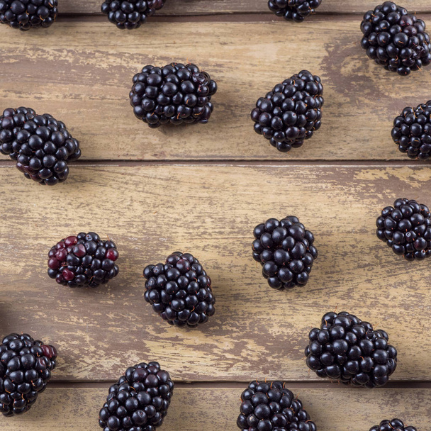 Fresh blackberry on wooden background - Фото, изображение