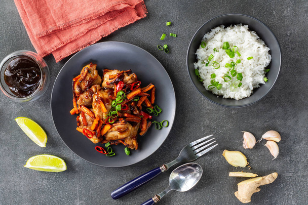 Teriyaki chicken, lime and bowl of rice on a gray background - Fotografie, Obrázek