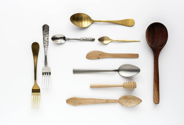 Spoons and forks on white background - Fotoğraf, Görsel