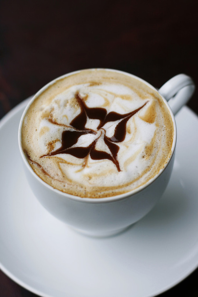 Delicious cappuccino with star design. - Foto, afbeelding