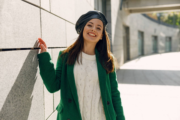 Positive delighted girl showing her stylish outfit - Photo, Image