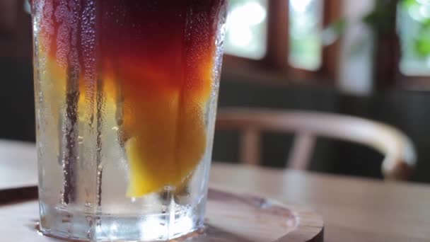 Close up iced glass of peach soda drink, stock footage - Footage, Video