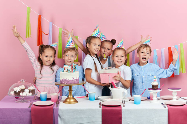 little cute girl has unforgettable birthday party with her sisters and brothers - Foto, Imagem