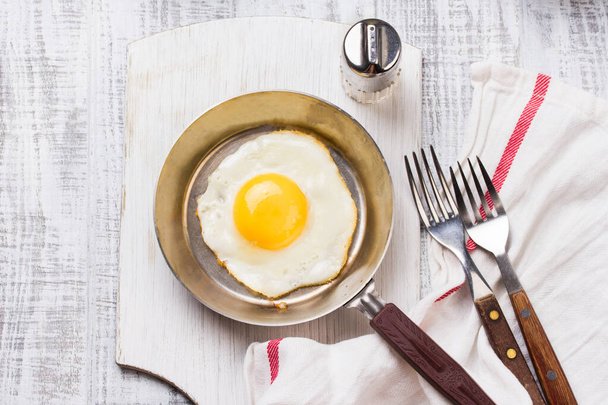Fried eggs in a frying pan. Food. Breakfast. Healthy food. - Фото, изображение