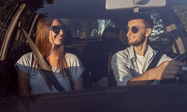 Young Sweet Couple Talking During Car Trip - Photo, image