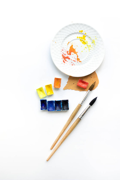 Happy autumn. Workplace with a plate, pens and watercolor palette, flat composition. - Photo, Image