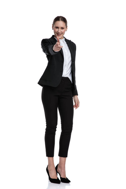 businesswoman standing and pointing forward happy - Фото, изображение