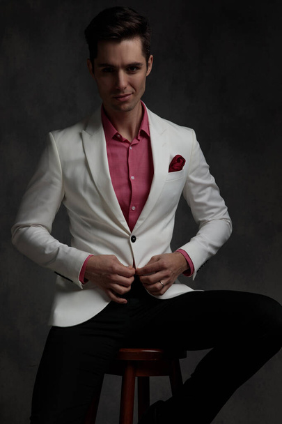 Motivated elegant man unbuttoning his jacket - Photo, Image