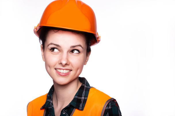 young woman builder in hard hat - Фото, изображение