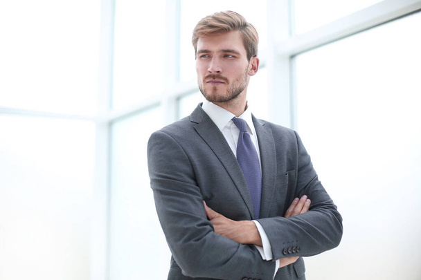 close up.serious young businessman standing in office. - Foto, Imagem