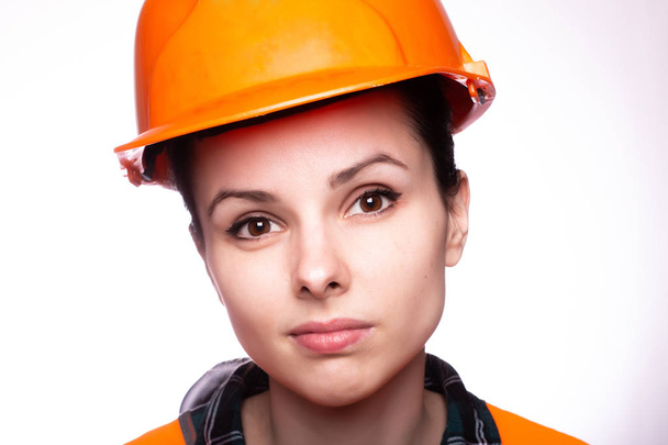 young woman builder in hard hat - Foto, Bild