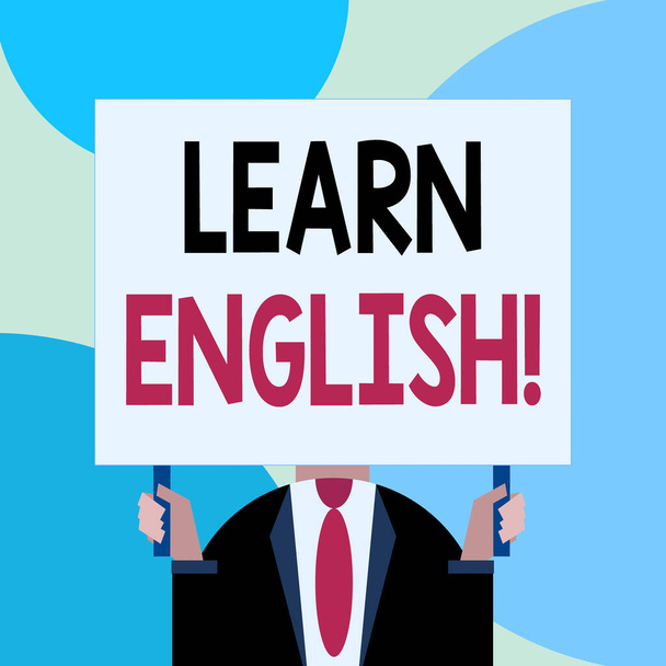 Handwriting text writing Learn English. Concept meaning gain acquire knowledge in new language by study Just man chest dressed dark suit tie no face holding blank big rectangle. - Photo, Image