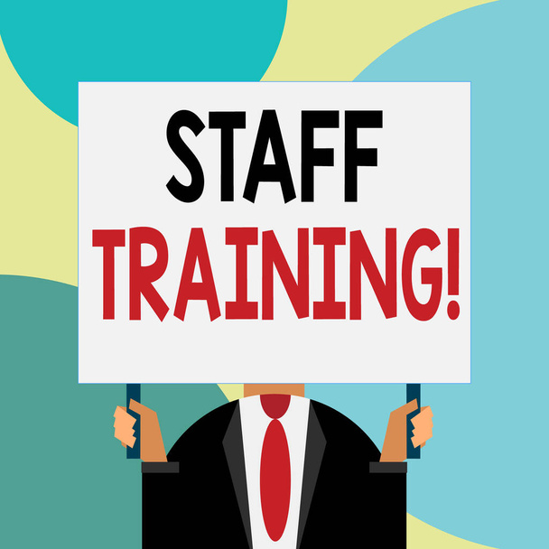 Handwriting text writing Staff Training. Concept meaning program that helps employees learn specific knowledge Just man chest dressed dark suit tie no face holding blank big rectangle. - Photo, Image