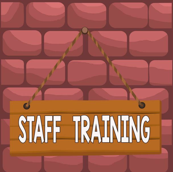 Handwriting text Staff Training. Concept meaning program that helps employees learn specific knowledge Wood plank nail pin string board colorful background wooden panel fixed. - Photo, Image
