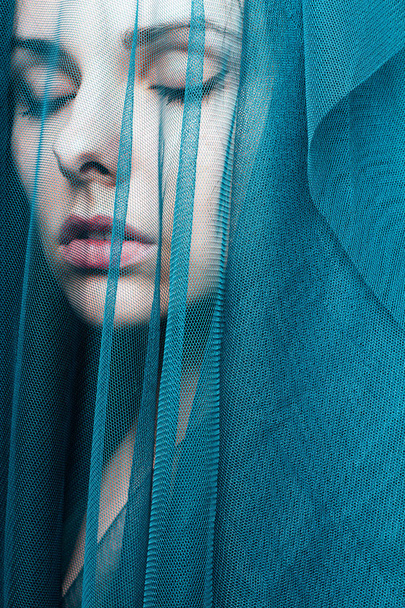 Young woman, blue color material - Foto, Imagem