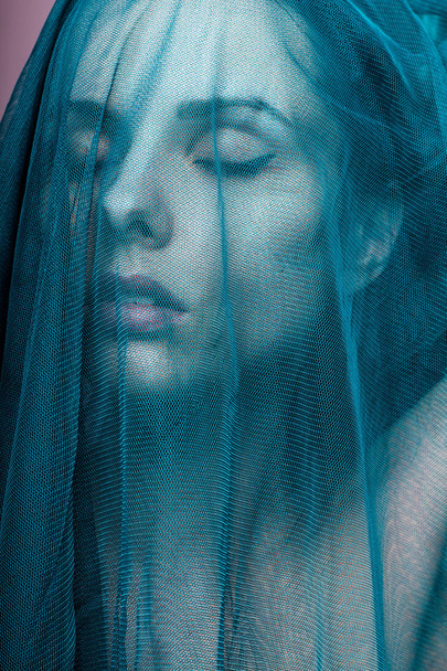 Young woman, blue color material - Foto, Imagem