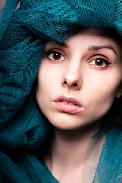 Young woman, blue color material - 写真・画像
