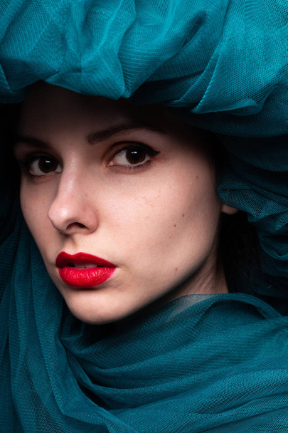 Young woman with red lipstick on her lips - Valokuva, kuva