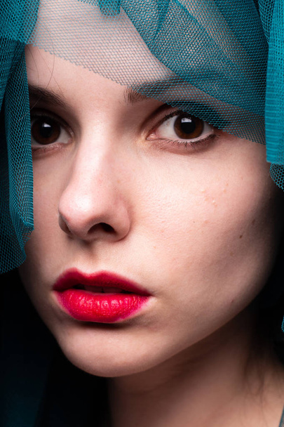 Young woman with red lipstick on her lips - 写真・画像