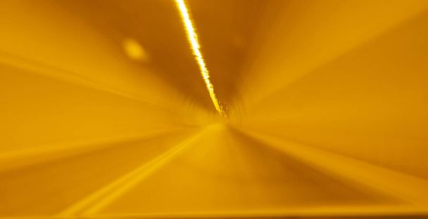 Abstract golden glow in tunnel. - Photo, Image