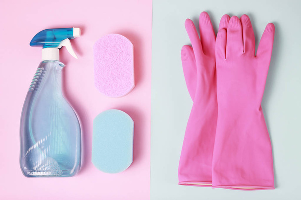 window spray, sponge on blue and pink background top view, spring cleaning concept - Photo, Image