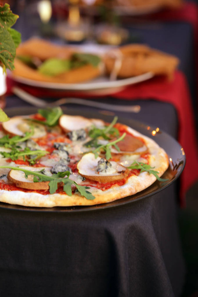 dinner table set pizza with pear and gorgonzola - Фото, зображення