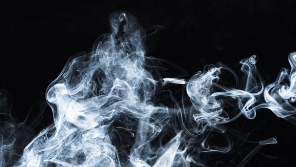 Photo of a wisp of smoke on a dark background - Fotó, kép