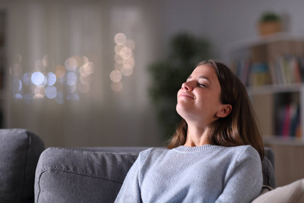 Relaxed homeowner breathing deeply fresh air at home - Fotó, kép