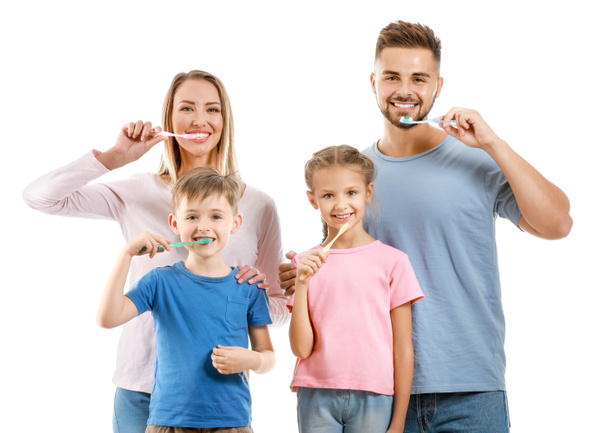 Portrait of family brushing teeth on white background - Foto, Imagem